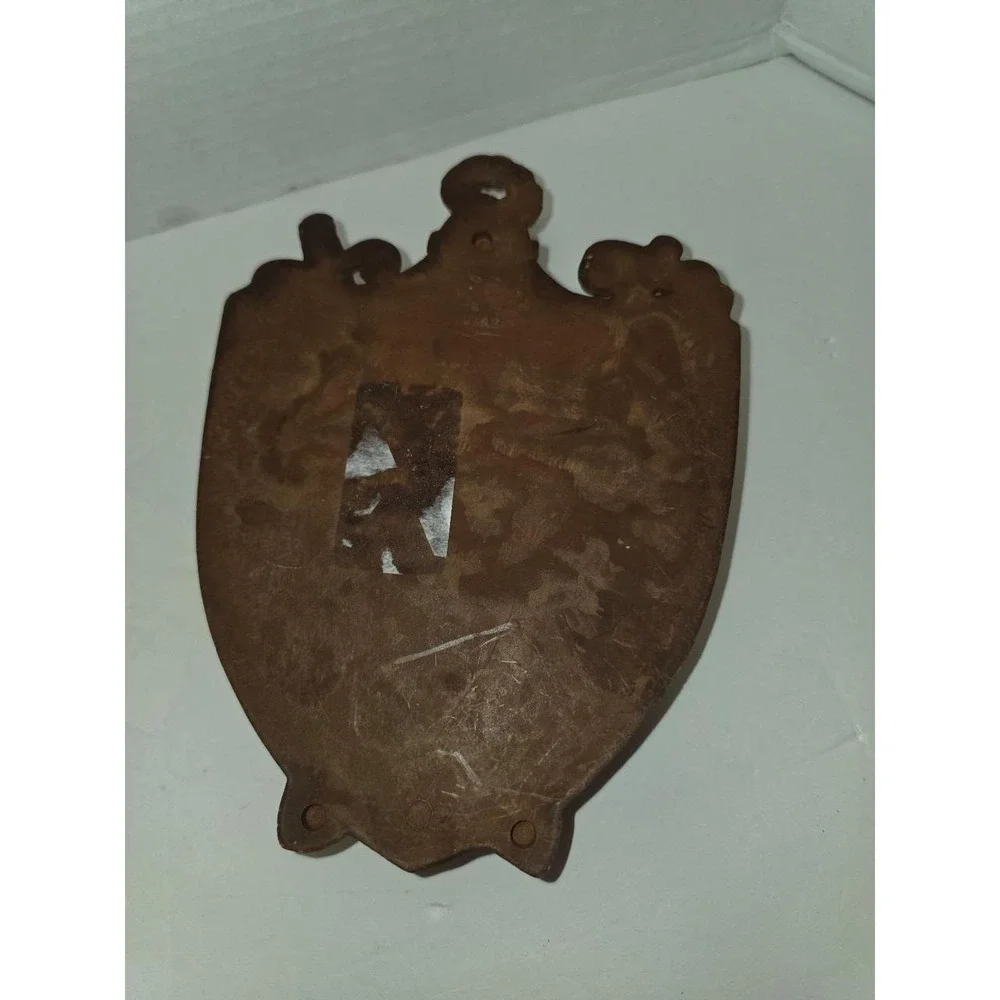 vintage faux wood composite shield-shaped wall plaque featuring a 